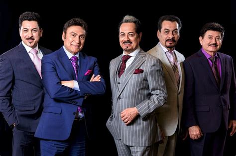 Watch the official music video of La Puerta Negra, a classic song by Los Tigres Del Norte, a legendary Mexican-American band. Find out their upcoming tour dates and tickets in the US.